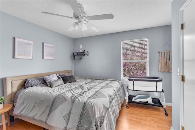 24101 S State Route K, Pleasant Hill, MO 64080 - bedroom featuring wood finished floors, ceiling fan, and baseboards