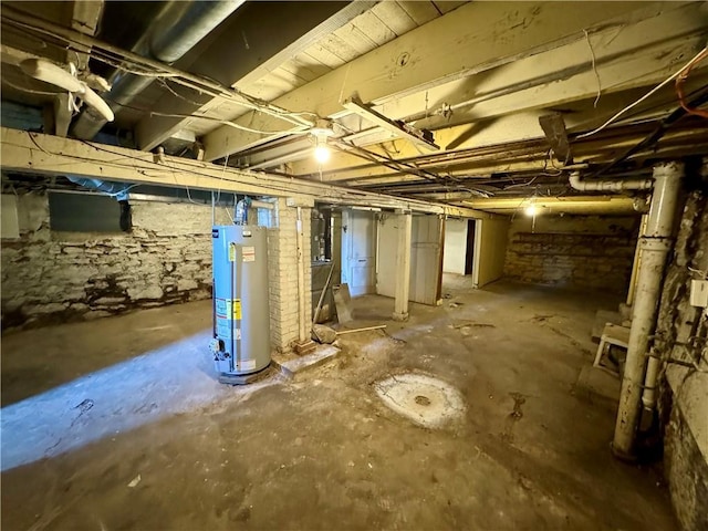 unfinished below grade area featuring gas water heater
