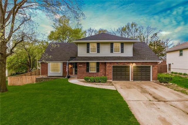 6806 N Euclid Ave, Kansas City, MO 64119 - traditional-style house with brick siding, a front lawn, fence, and concrete driveway