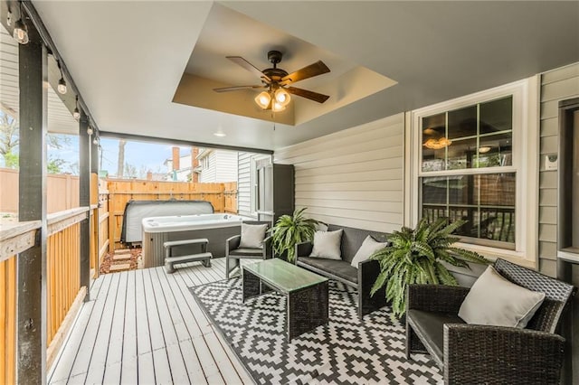 6806 N Euclid Ave, Kansas City, MO 64119 - wooden deck with ceiling fan, a hot tub, fence, and outdoor lounge area
