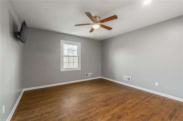 6806 N Euclid Ave, Kansas City, MO 64119 - empty room with visible vents, baseboards, and dark wood finished floors