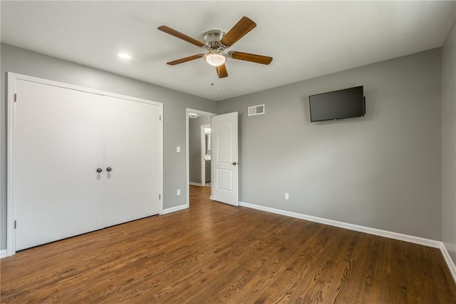 6806 N Euclid Ave, Kansas City, MO 64119 - unfurnished bedroom featuring baseboards, visible vents, wood finished floors, and a closet