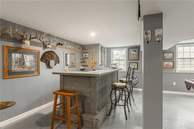 6806 N Euclid Ave, Kansas City, MO 64119 - bar with baseboards and indoor bar