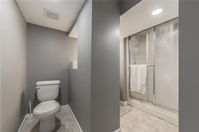6806 N Euclid Ave, Kansas City, MO 64119 - bathroom featuring tile patterned flooring, toilet, baseboards, visible vents, and a stall shower