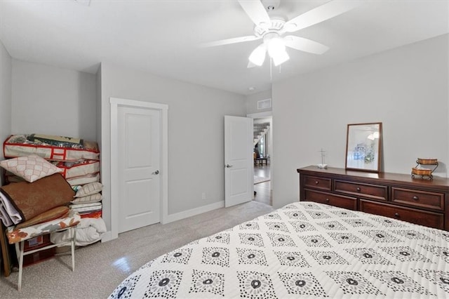bedroom with baseboards, ceiling fan, and light carpet