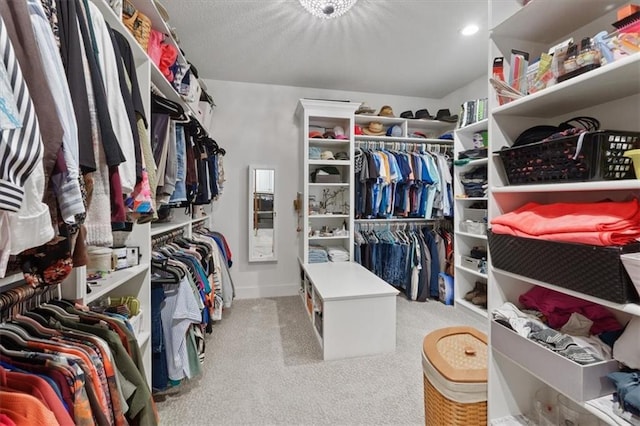 walk in closet featuring carpet