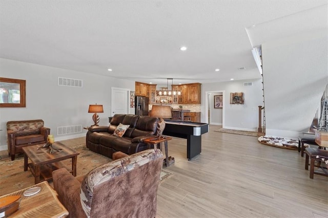 living area featuring baseboards, light wood finished floors, recessed lighting, and billiards table