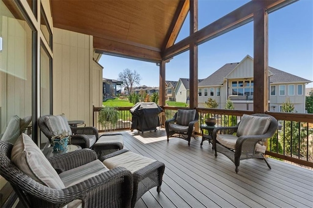 deck with a residential view and grilling area