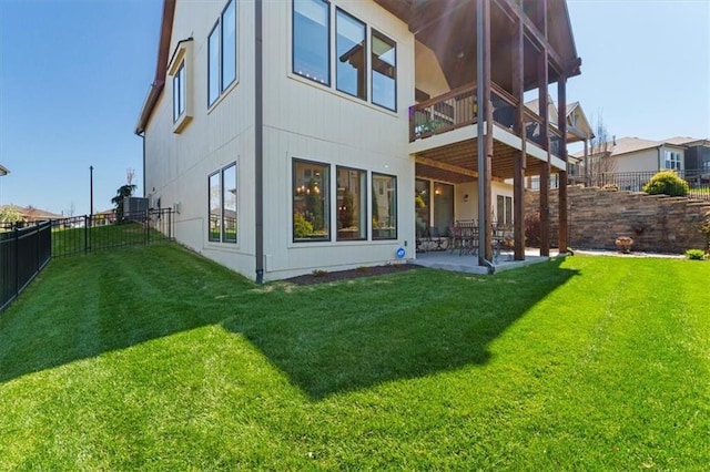 back of property featuring a patio, a balcony, and central AC