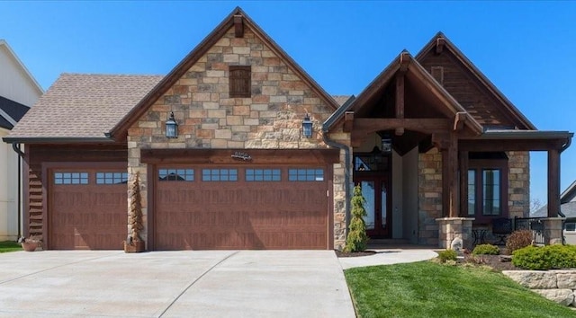 8856 Freedom St, Lenexa, KS 66227 - view of front of property featuring stone siding, driveway, and a garage