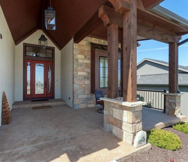 8856 Freedom St, Lenexa, KS 66227 - entrance to property featuring stone siding and stucco siding