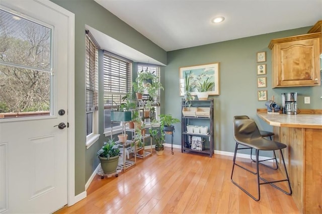 interior space featuring recessed lighting, light wood-type flooring, and baseboards