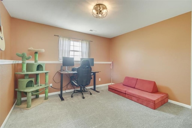 carpeted home office with baseboards