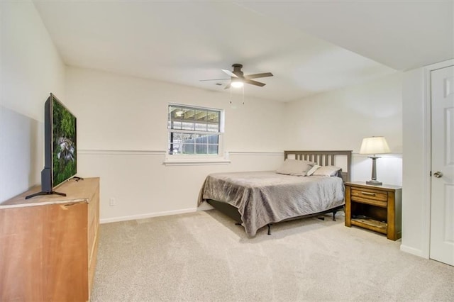 bedroom with ceiling fan, baseboards, and carpet floors