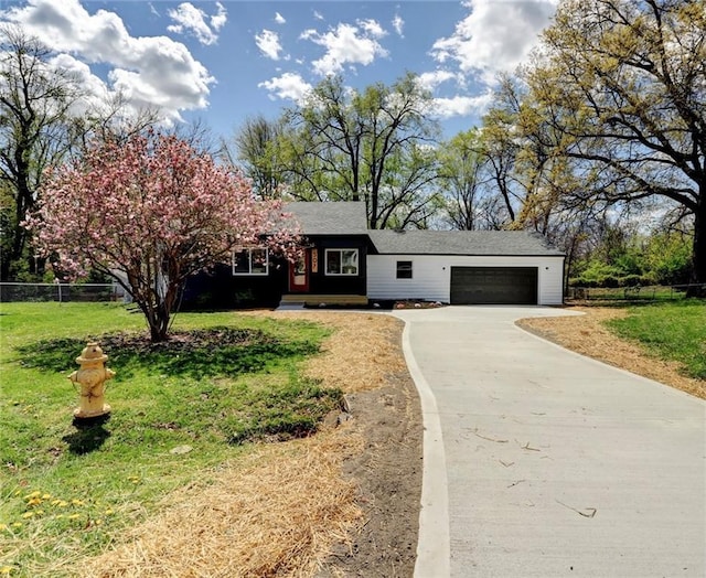 single story home with fence, a garage, a front yard, and driveway