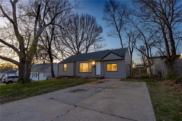 9904 E 60th Ter, Raytown, MO 64133 - view of front of property with fence and a lawn