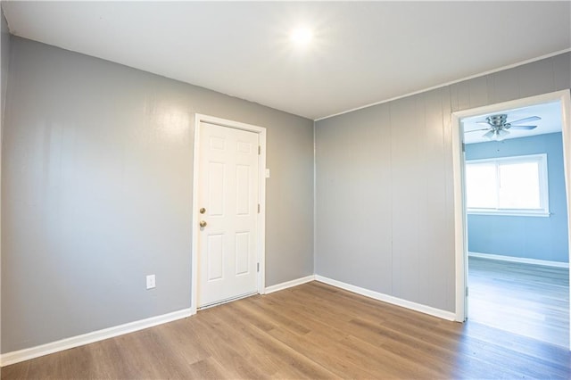 9904 E 60th Ter, Raytown, MO 64133 - spare room featuring wood finished floors and baseboards