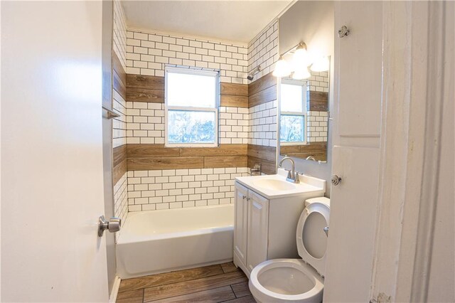 9904 E 60th Ter, Raytown, MO 64133 - full bath with toilet, vanity, and wood finished floors