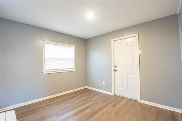 9904 E 60th Ter, Raytown, MO 64133 - spare room with wood finished floors and baseboards