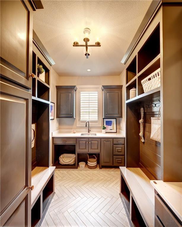 16046 S Twilight Ln, Olathe, KS 66062 - mudroom featuring a sink, a textured ceiling, and recessed lighting