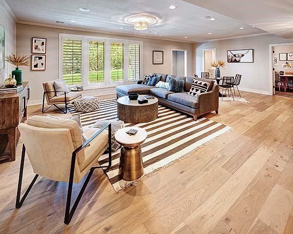 16046 S Twilight Ln, Olathe, KS 66062 - living area featuring crown molding, light wood-style flooring, baseboards, and recessed lighting