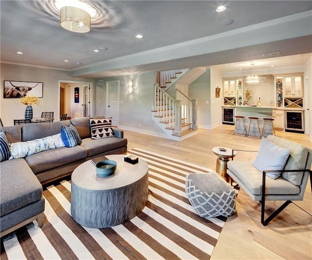 16046 S Twilight Ln, Olathe, KS 66062 - living room with wine cooler, stairway, recessed lighting, light wood-style flooring, and baseboards