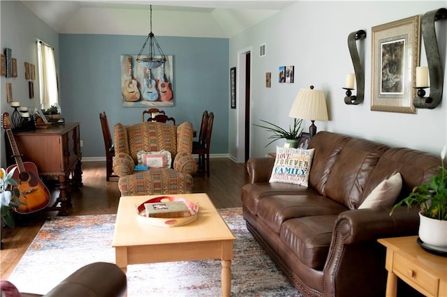 4413 E 107th St, Kansas City, MO 64137 - living area featuring wood finished floors and lofted ceiling