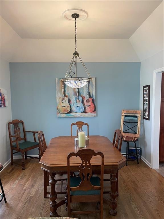 4413 E 107th St, Kansas City, MO 64137 - dining room featuring wood finished floors and lofted ceiling