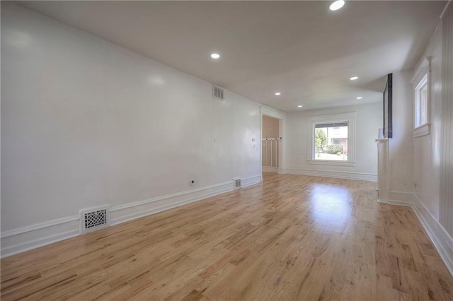 1607 E 37th St, Kansas City, MO 64109 - unfurnished room featuring light wood-style flooring, recessed lighting, and baseboards