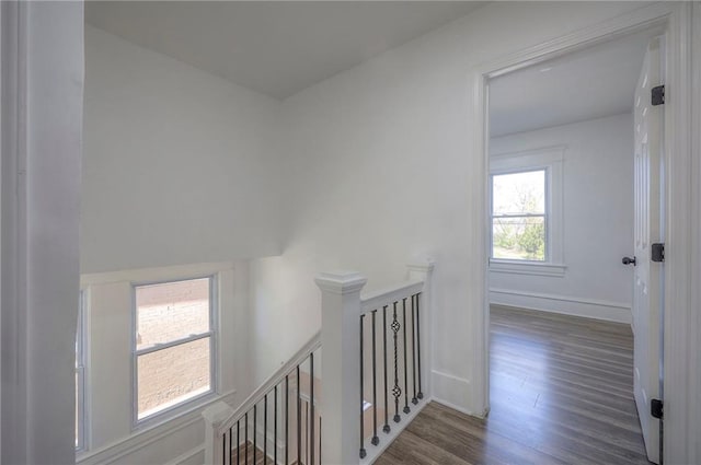 1607 E 37th St, Kansas City, MO 64109 - hall featuring an upstairs landing, wood finished floors, and baseboards