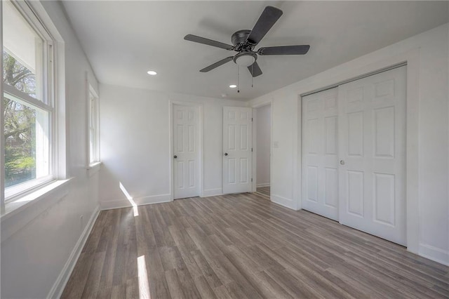 1607 E 37th St, Kansas City, MO 64109 - unfurnished bedroom with wood finished floors, recessed lighting, baseboards, a ceiling fan, and a closet