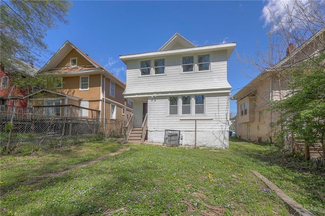 1607 E 37th St, Kansas City, MO 64109 - rear view of house featuring a yard