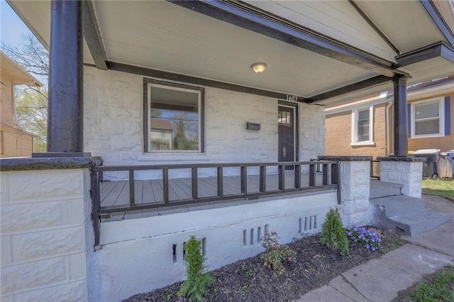 1607 E 37th St, Kansas City, MO 64109 - entrance to property featuring a porch and stone siding