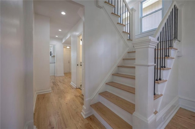 1607 E 37th St, Kansas City, MO 64109 - staircase with wood finished floors, recessed lighting, and baseboards