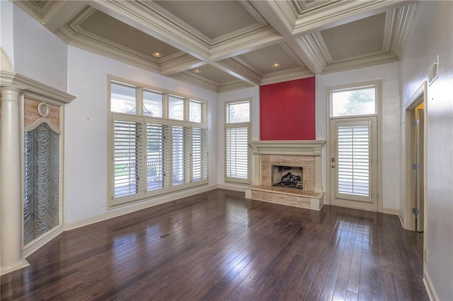 unfurnished living room with a wealth of natural light, coffered ceiling, hardwood / wood-style flooring, and a fireplace