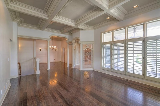 unfurnished living room with decorative columns, arched walkways, a healthy amount of sunlight, and coffered ceiling