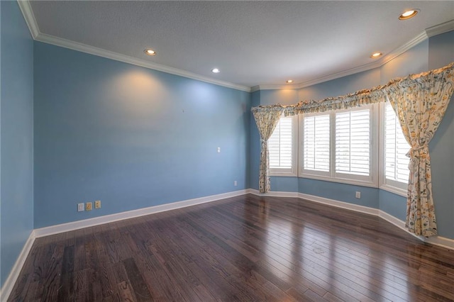 spare room with ornamental molding, baseboards, recessed lighting, and wood finished floors