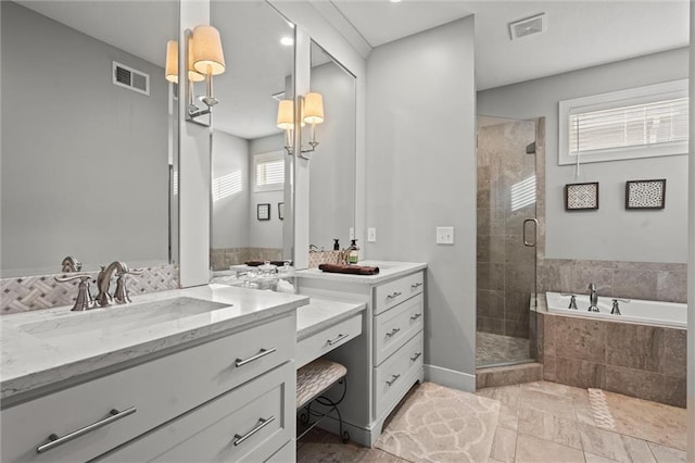 4513 NE Parks Summit Ter, Lees Summit, MO 64064 - full bath featuring a stall shower, a garden tub, vanity, and visible vents