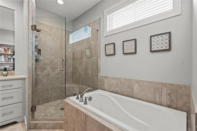 4513 NE Parks Summit Ter, Lees Summit, MO 64064 - bathroom with a shower stall, a garden tub, and vanity