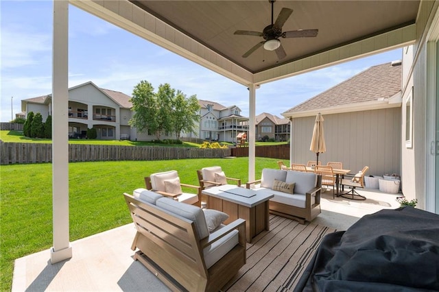 4513 NE Parks Summit Ter, Lees Summit, MO 64064 - fenced backyard with an outdoor living space, a residential view, a ceiling fan, outdoor dining area, and a patio area