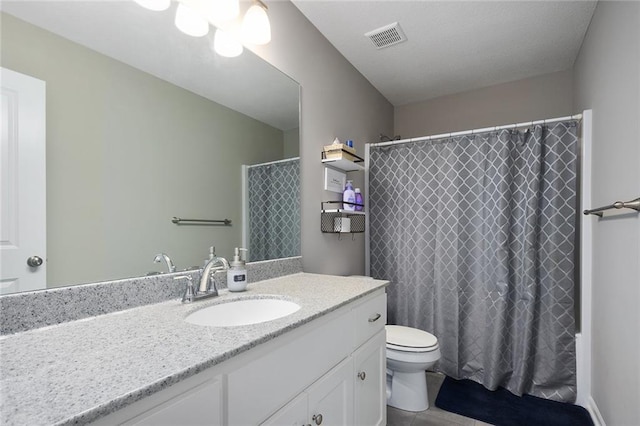 full bathroom featuring vanity, curtained shower, tile patterned floors, toilet, and visible vents