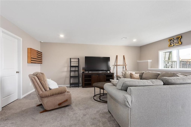 living area with baseboards, recessed lighting, and light colored carpet