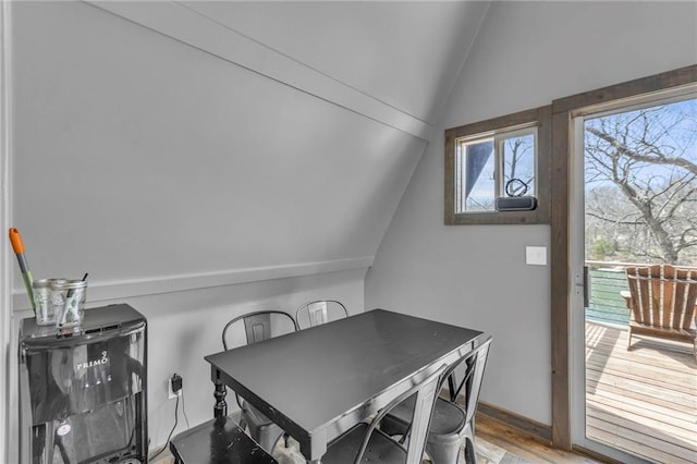 122 W Lou Ann Dr, Lacygne, KS 66040 - dining room featuring vaulted ceiling and wood finished floors
