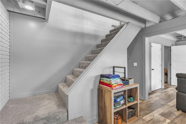 122 W Lou Ann Dr, Lacygne, KS 66040 - staircase featuring wood finished floors and brick wall