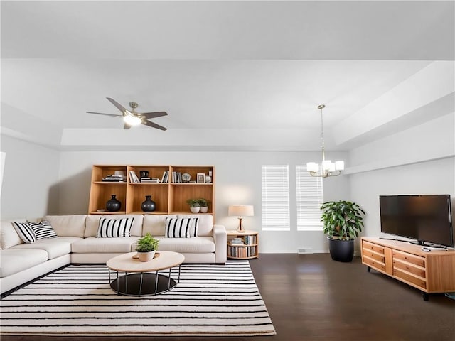 12207 N Pomona Ave, Kansas City, MO 64163 - living area featuring ceiling fan with notable chandelier, wood finished floors, baseboards, and visible vents