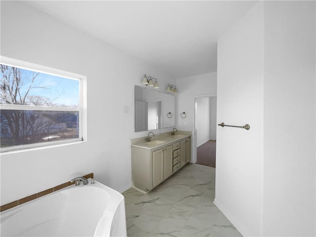 12207 N Pomona Ave, Kansas City, MO 64163 - full bath with double vanity, marble finish floor, a sink, and a washtub