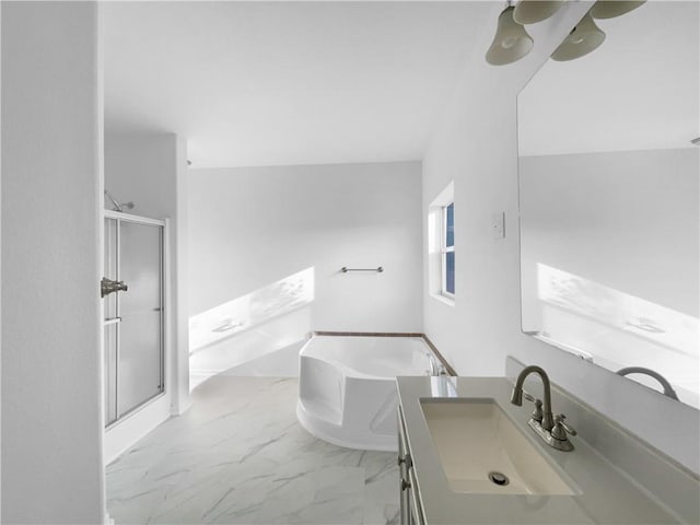 12207 N Pomona Ave, Kansas City, MO 64163 - full bathroom with a shower stall, a freestanding tub, vanity, and marble finish floor