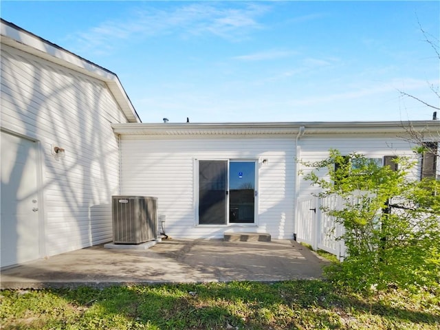 12207 N Pomona Ave, Kansas City, MO 64163 - rear view of house featuring a patio area and central AC unit