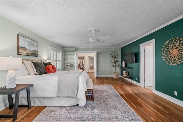 6721 Santa Fe Dr, Overland Park, KS 66204 - bedroom featuring ornamental molding, baseboards, wood finished floors, and a textured ceiling