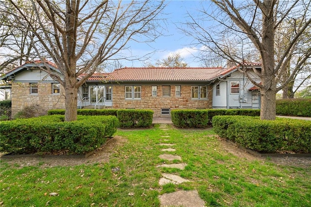 6721 Santa Fe Dr, Overland Park, KS 66204 - view of front of property with a front yard, a tile roof, and stone siding